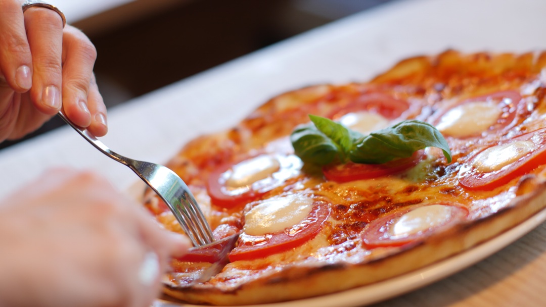 Woman eating a pizza