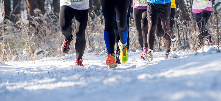 Small group of runners in the snow