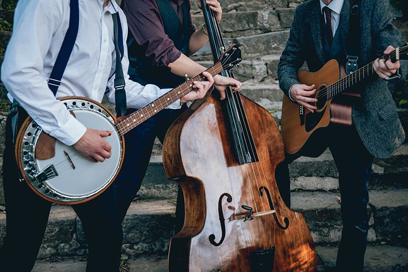 Trio playing banjo, bass, and guitar