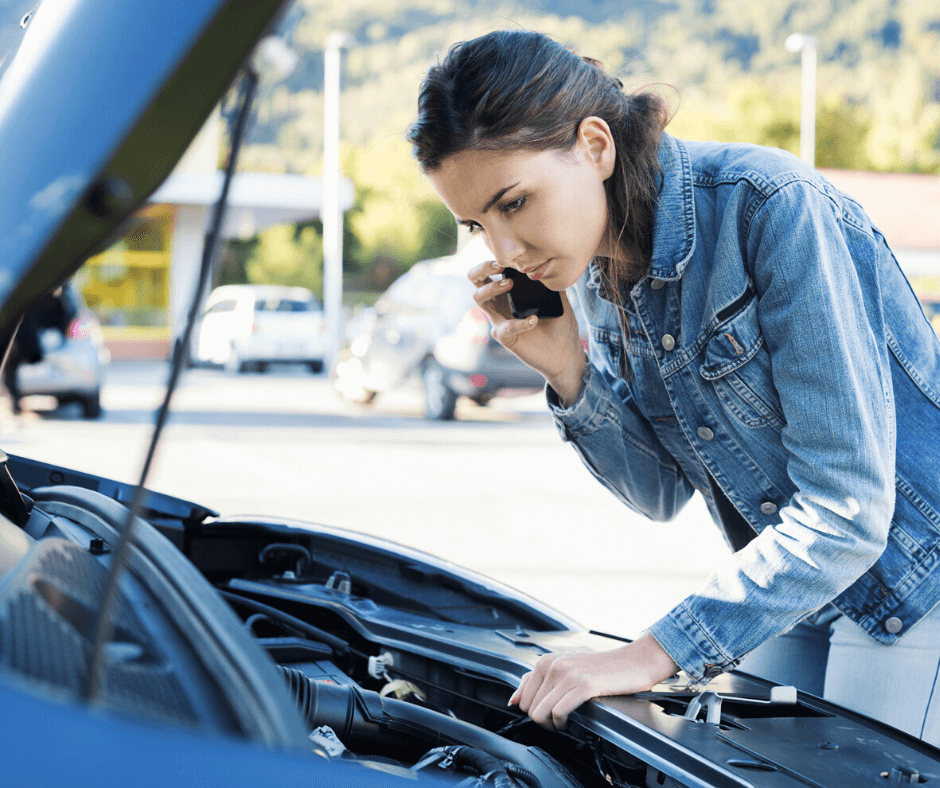 Woman with car trouble on mobile phone