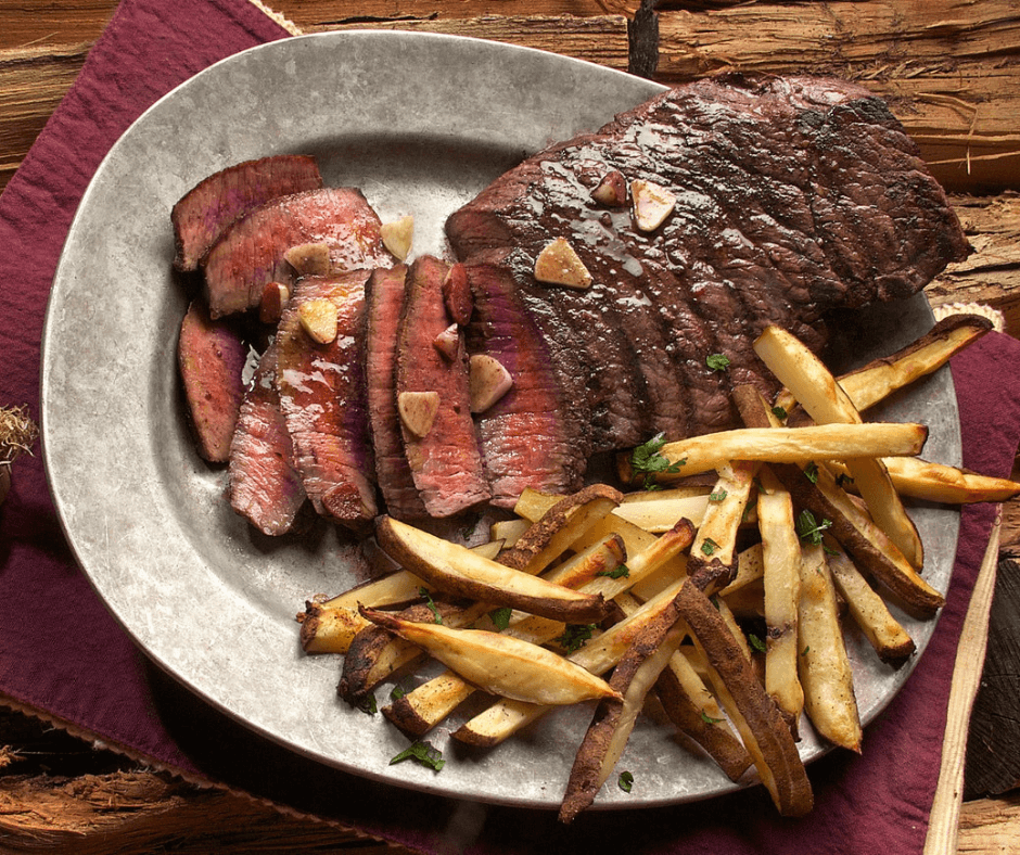 Photo of steak and french fries on a platter. Photo credit: Kasumi Loffler