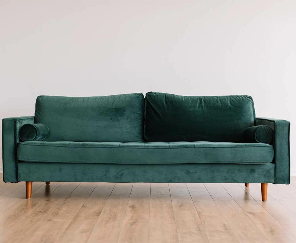 Green velour couch. Photo credit: Phillip Goldsberry