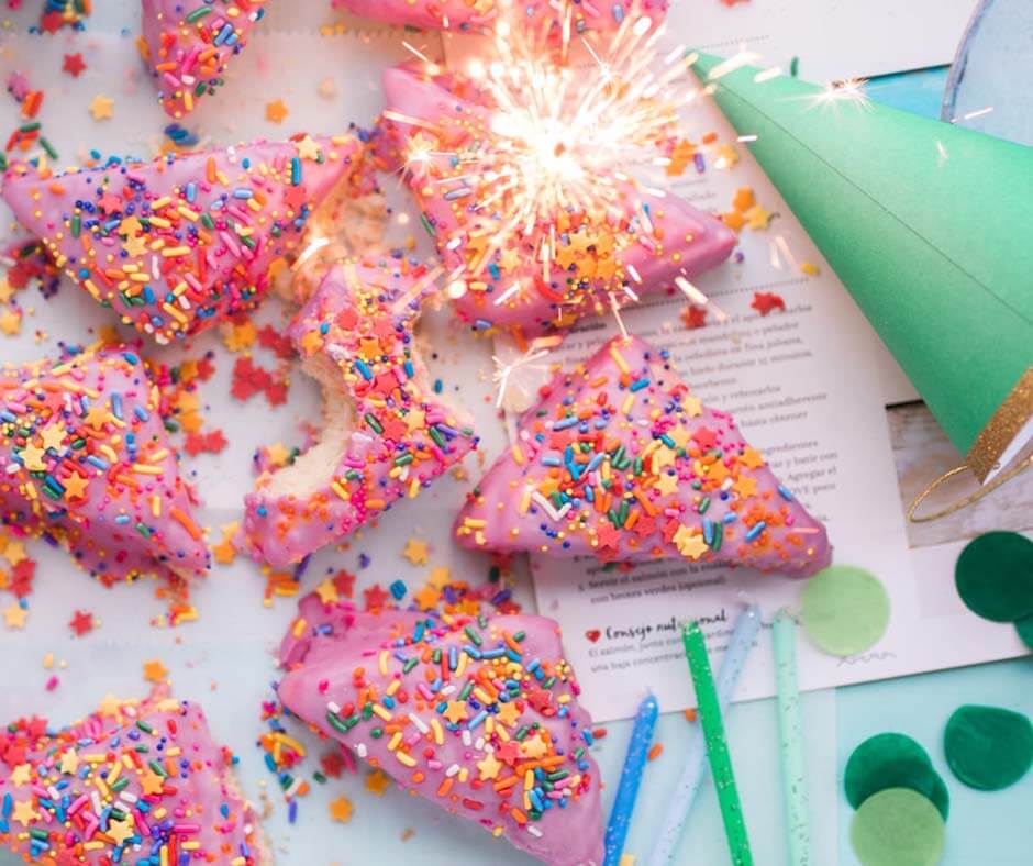 Party snacks, party hats, and a sparkler.
