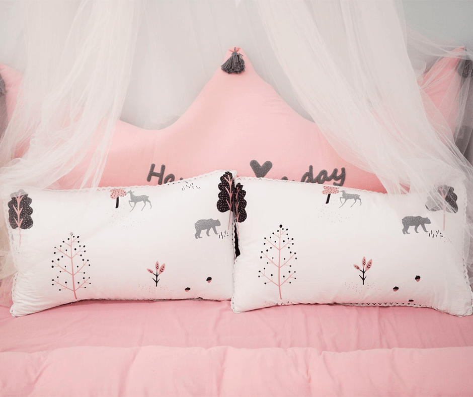 Bed with a pink duvet. Image credit: Cat Common