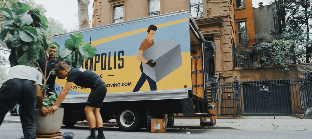 Moving truck on the street outside an apartment. Image credit: HandiworkNYC