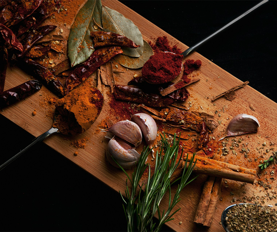 A variety of spices on a cutting board. Image credit: Zahrin Lukman